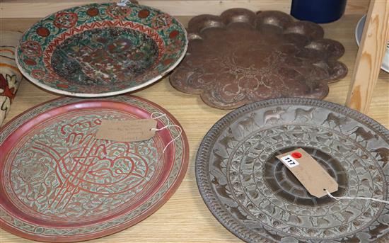 Three Middle Eastern metal ware trays and a Chinese porcelain bowl